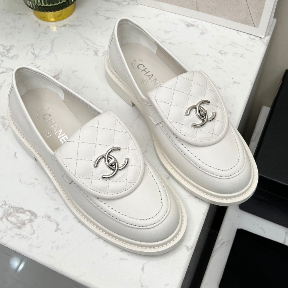 CC Quilted Turnlock Loafers, in white. Size 38.